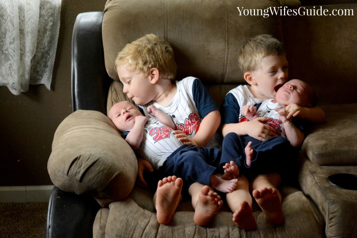 Kissing their baby brothers